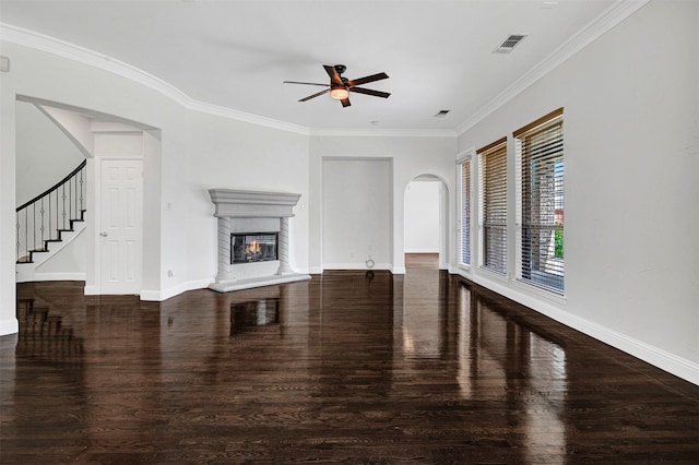 2353 Salisbury Ct, The Colony, TX 75056 - unfurnished living room with wood finished floors, a ceiling fan, arched walkways, baseboards, and crown molding