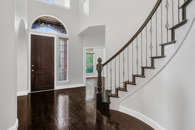 2353 Salisbury Ct, The Colony, TX 75056 - entrance foyer with wood-type flooring, baseboards, stairway, and a towering ceiling