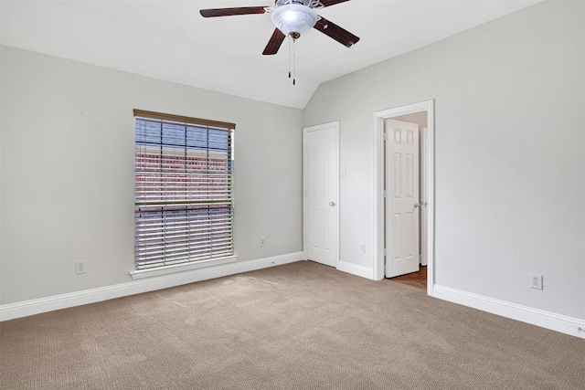 2353 Salisbury Ct, The Colony, TX 75056 - unfurnished bedroom with carpet flooring, baseboards, lofted ceiling, and a ceiling fan