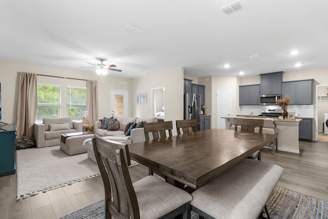 1304 Villalonga Dr, Little Elm, TX 75068 - dining area with light wood-style flooring, ceiling fan, washer / dryer, and recessed lighting