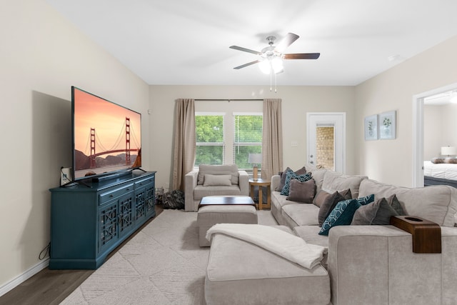 1304 Villalonga Dr, Little Elm, TX 75068 - living area featuring ceiling fan, wood finished floors, and baseboards