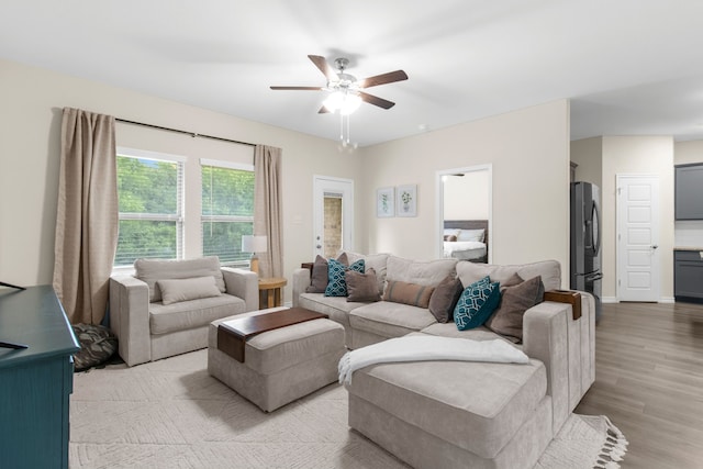 1304 Villalonga Dr, Little Elm, TX 75068 - living room with a ceiling fan and light wood-style floors