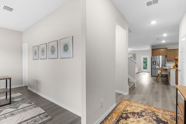 1304 Villalonga Dr, Little Elm, TX 75068 - corridor featuring light wood finished floors, baseboards, stairs, and recessed lighting