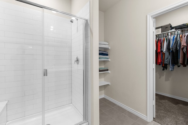 1304 Villalonga Dr, Little Elm, TX 75068 - full bathroom with a spacious closet, a shower stall, and tile patterned flooring