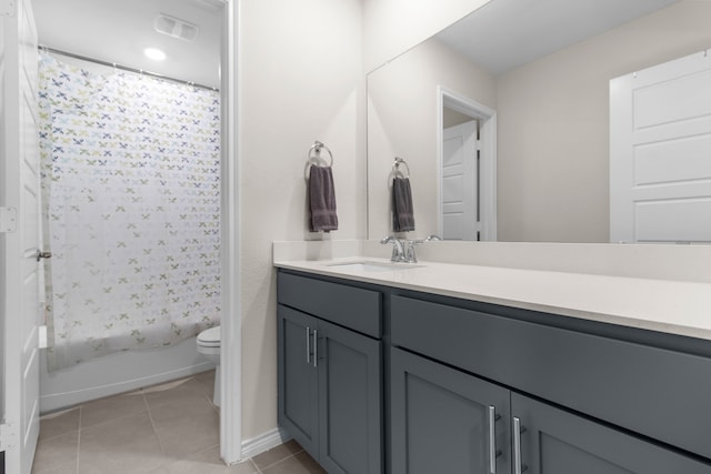 1304 Villalonga Dr, Little Elm, TX 75068 - full bathroom with toilet, vanity, tile patterned flooring, shower / tub combo with curtain, and baseboards