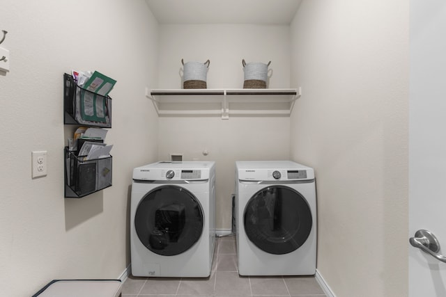 1304 Villalonga Dr, Little Elm, TX 75068 - laundry area featuring separate washer and dryer, light tile patterned floors, and baseboards