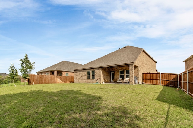 1304 Villalonga Dr, Little Elm, TX 75068 - back of property with brick siding and a shingled roof