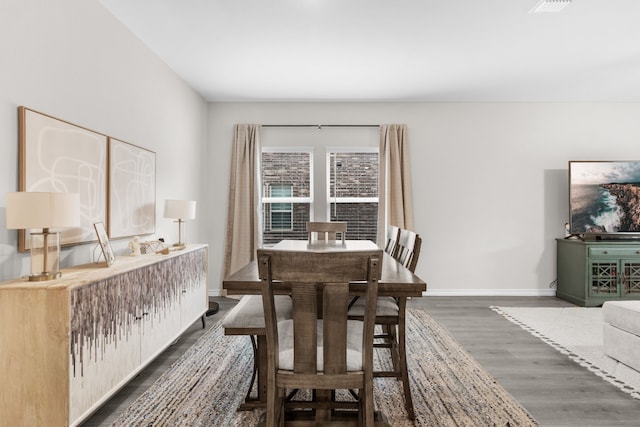 1304 Villalonga Dr, Little Elm, TX 75068 - dining space featuring dark wood-style floors and baseboards