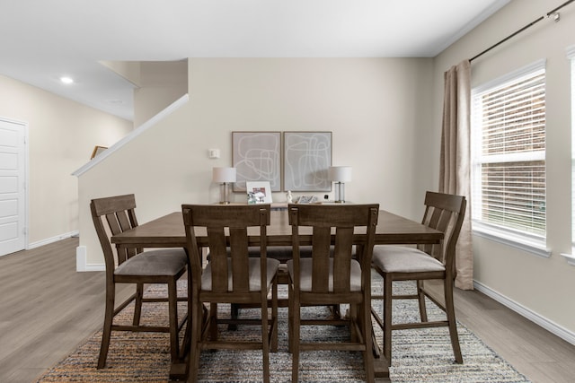 1304 Villalonga Dr, Little Elm, TX 75068 - dining space with light wood-style floors, baseboards, plenty of natural light, recessed lighting, and stairway