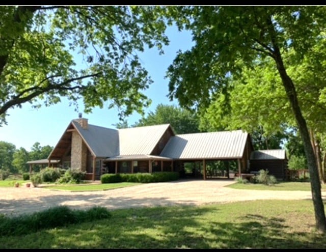 783 County Rd 4420, Whitewright, TX 75491 - view of front facade featuring a front yard, metal roof, and a chimney