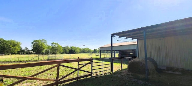 783 County Rd 4420, Whitewright, TX 75491 - view of yard with an exterior structure, a rural view, and an outbuilding