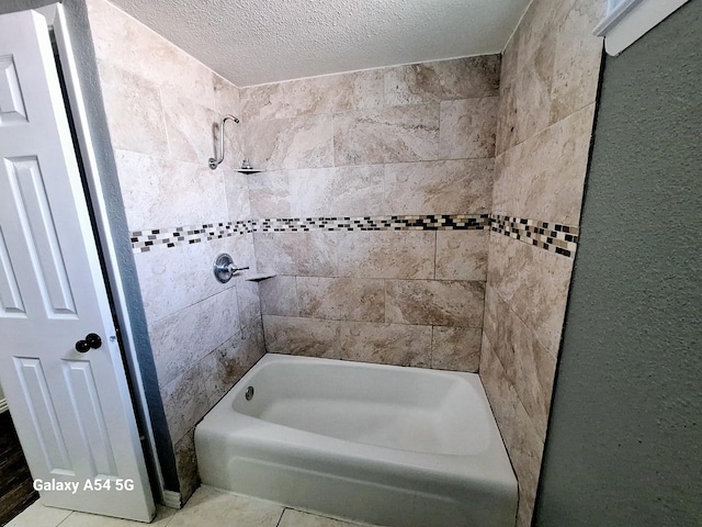 826 E Center St, Duncanville, TX 75116 - full bathroom with tub / shower combination, a textured ceiling, and tile patterned floors