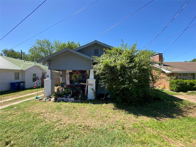1826 W Morton St, Denison, TX 75020 - view of front of home with a front lawn