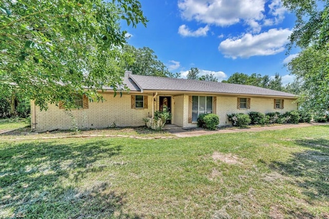 1700 Sunset Rd, Robinson, TX 76706 - ranch-style home featuring brick siding and a front yard