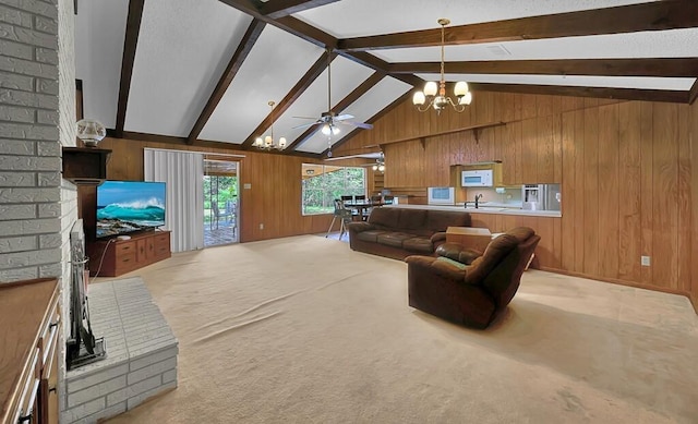 1700 Sunset Rd, Robinson, TX 76706 - living area with a chandelier, wood walls, light carpet, and ceiling fan