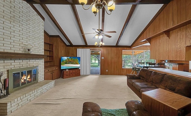 1700 Sunset Rd, Robinson, TX 76706 - living room with a chandelier, wooden walls, beam ceiling, ceiling fan, and light carpet