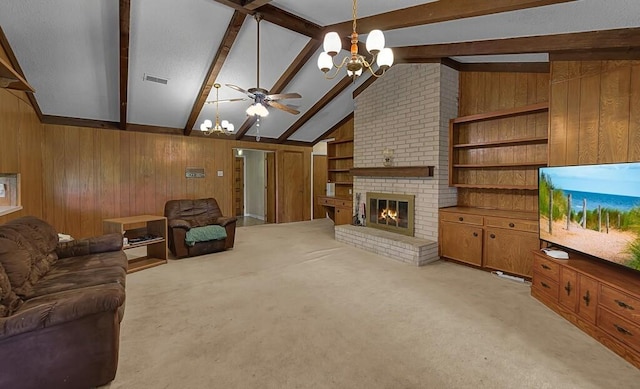 1700 Sunset Rd, Robinson, TX 76706 - living area featuring a chandelier, wooden walls, a ceiling fan, a brick fireplace, and light colored carpet