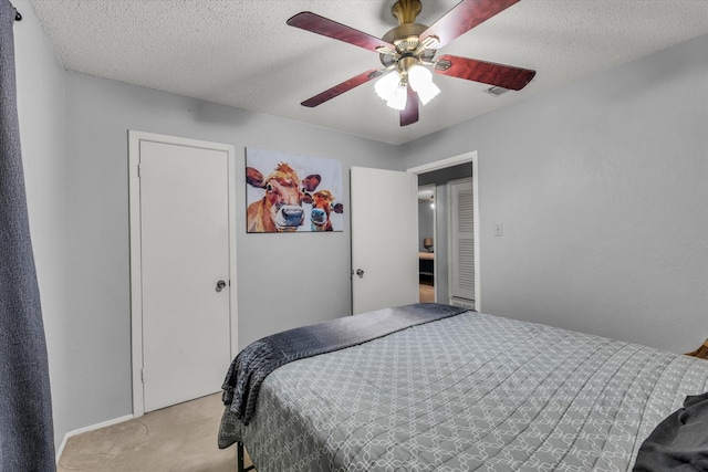 1313 Crow Dr, Waco, TX 76705 - bedroom with light carpet, a ceiling fan, and a textured ceiling