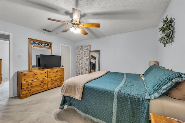1313 Crow Dr, Waco, TX 76705 - carpeted bedroom with a ceiling fan and a textured ceiling