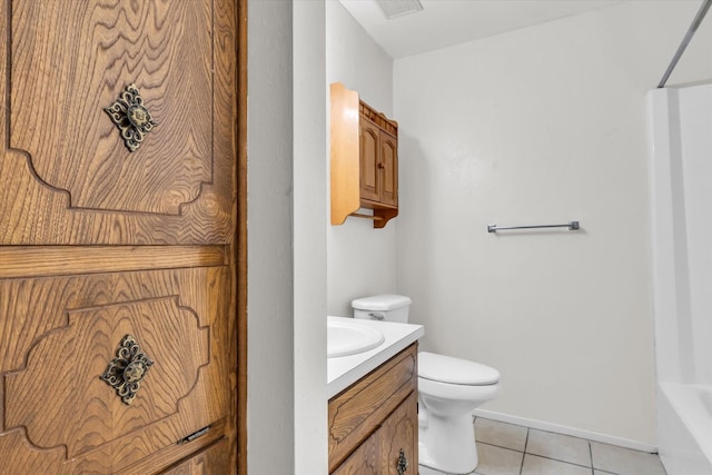 1313 Crow Dr, Waco, TX 76705 - bathroom with toilet, vanity, tile patterned floors, and baseboards