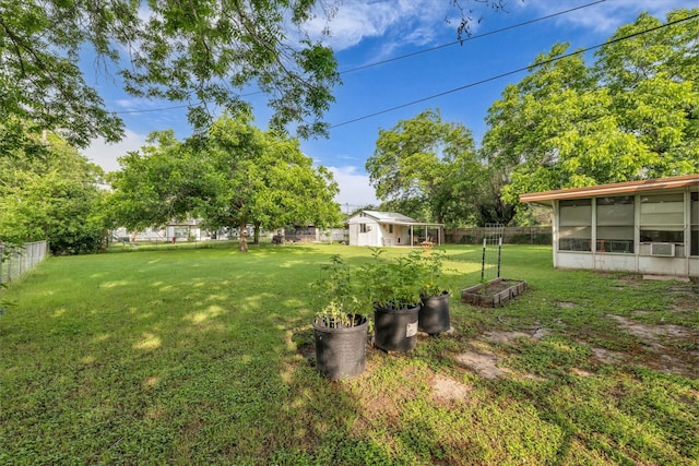 1313 Crow Dr, Waco, TX 76705 - view of yard featuring a sunroom and an outbuilding