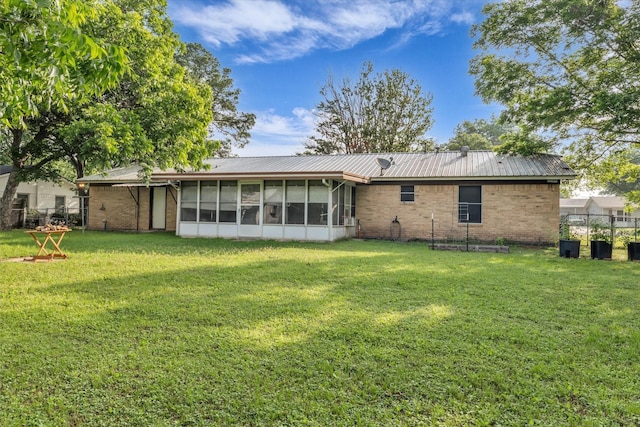 1313 Crow Dr, Waco, TX 76705 - rear view of property with a sunroom, brick siding, and metal roof