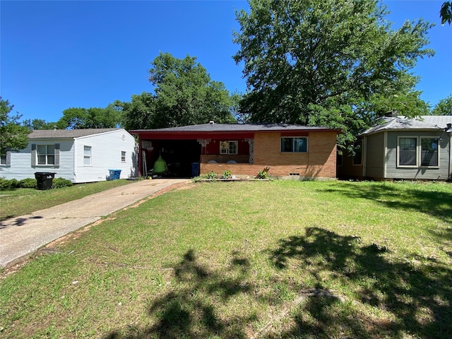 617 W Bullock St, Denison, TX 75020 - ranch-style home featuring an attached carport, driveway, a front yard, and brick siding