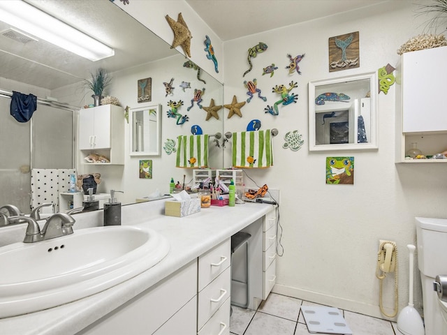 360 Diamond Bar Trl, Aledo, TX 76008 - full bathroom featuring a stall shower, vanity, tile patterned floors, toilet, and baseboards