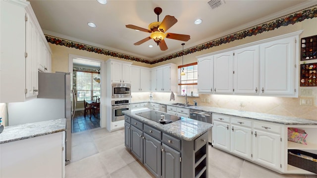 7534 Wellesley Ave, Garland, TX 75044 - kitchen featuring stainless steel appliances, gray cabinetry, white cabinets, plenty of natural light, and crown molding