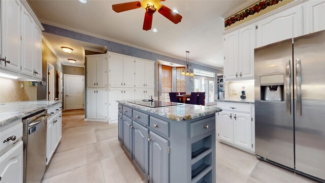 7534 Wellesley Ave, Garland, TX 75044 - kitchen with appliances with stainless steel finishes, white cabinets, gray cabinetry, a ceiling fan, and ornamental molding