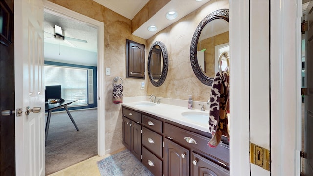 7534 Wellesley Ave, Garland, TX 75044 - bathroom with double vanity, a ceiling fan, and crown molding