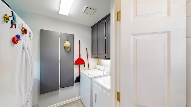 7534 Wellesley Ave, Garland, TX 75044 - laundry room featuring cabinet space and washing machine and dryer