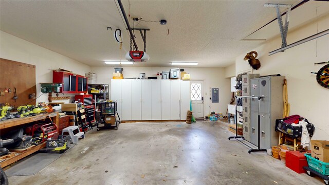 7534 Wellesley Ave, Garland, TX 75044 - garage featuring electric panel, a garage door opener, and a workshop area