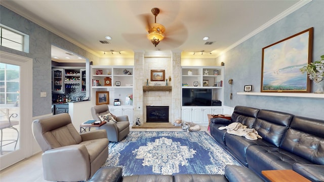 7534 Wellesley Ave, Garland, TX 75044 - living room with a dry bar, ornamental molding, a fireplace, and a ceiling fan