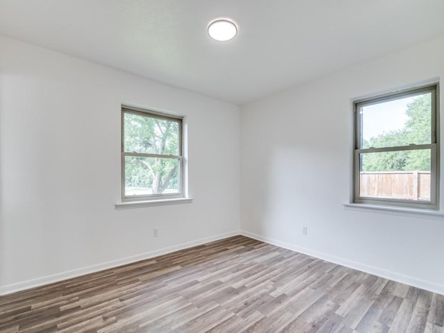 1429 Meadowcrest Dr, Plano, TX 75075 - empty room featuring wood finished floors and baseboards