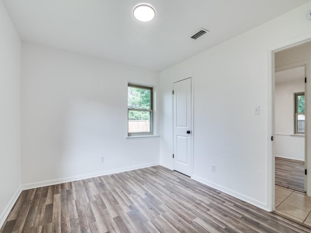 1429 Meadowcrest Dr, Plano, TX 75075 - unfurnished bedroom featuring wood finished floors, baseboards, and a closet
