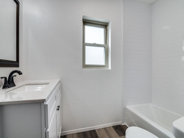 1429 Meadowcrest Dr, Plano, TX 75075 - bathroom with wood finished floors, vanity, toilet, baseboards, and shower / bath combination