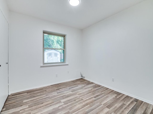 1429 Meadowcrest Dr, Plano, TX 75075 - unfurnished room featuring light wood-style flooring and baseboards