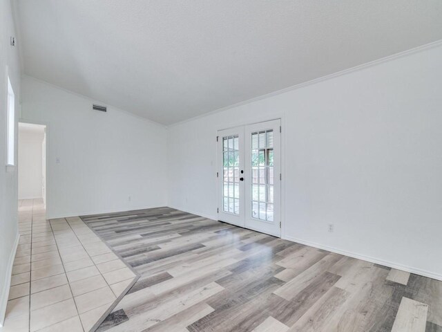 1429 Meadowcrest Dr, Plano, TX 75075 - spare room with french doors, light wood-type flooring, and crown molding