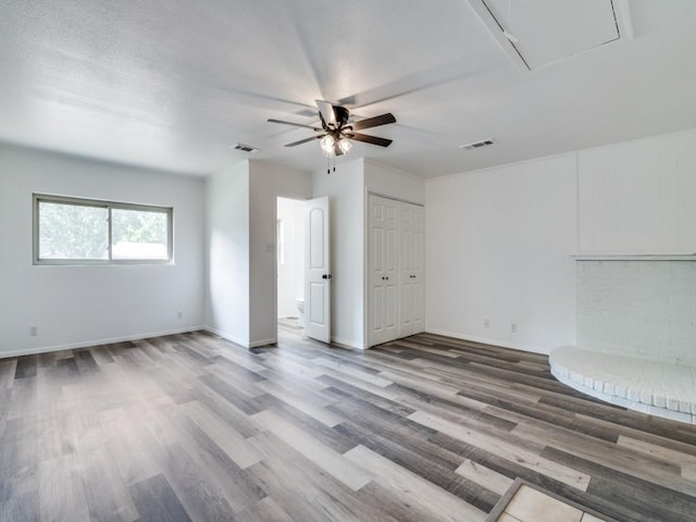 1429 Meadowcrest Dr, Plano, TX 75075 - spare room with attic access, ceiling fan, wood finished floors, and baseboards