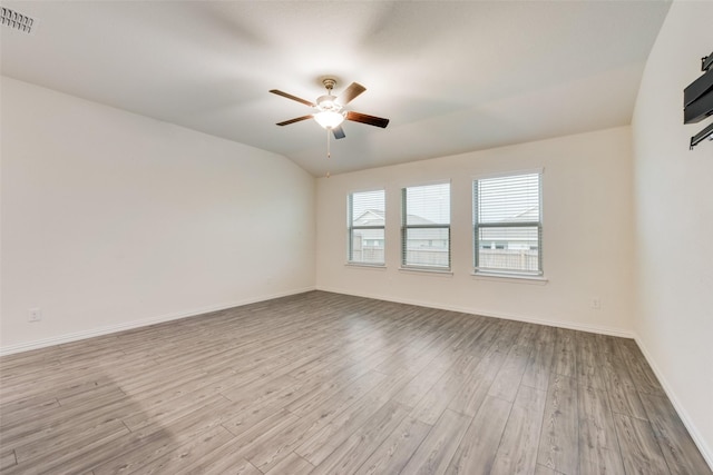 6100 Fall Creek Ln, Fort Worth, TX 76123 - spare room with wood finished floors, ceiling fan, baseboards, and vaulted ceiling
