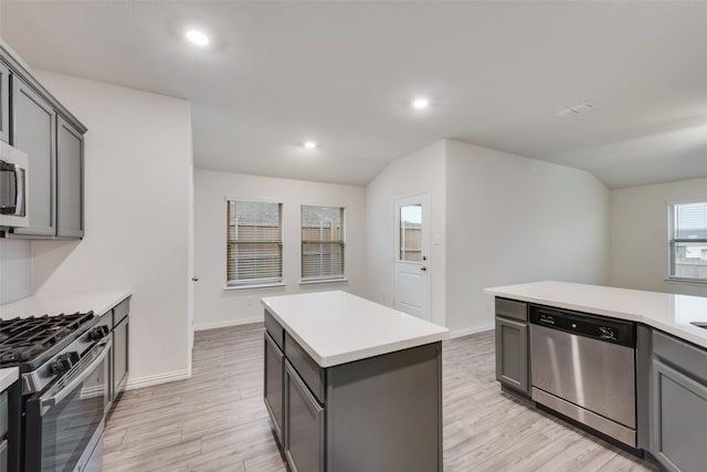 6100 Fall Creek Ln, Fort Worth, TX 76123 - kitchen with stainless steel appliances, gray cabinetry, light countertops, a center island, and recessed lighting