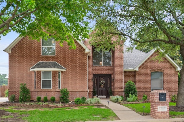 5505 Moorewood Dr, Arlington, TX 76017 - traditional-style house with brick siding, a shingled roof, and a chimney