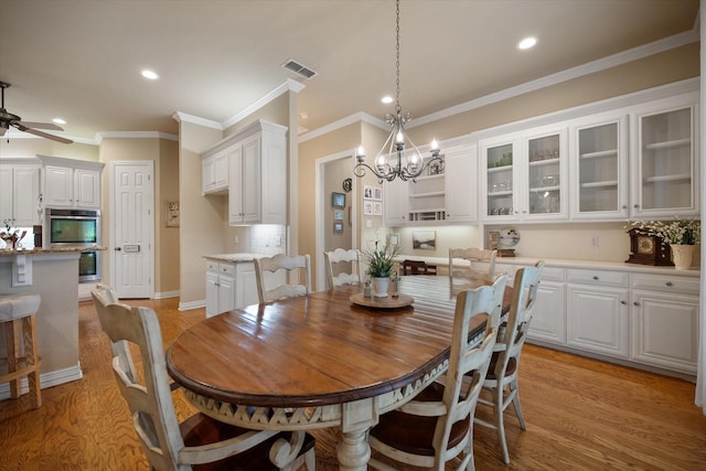 5505 Moorewood Dr, Arlington, TX 76017 - dining space featuring recessed lighting, ceiling fan, light wood-type flooring, a chandelier, and ornamental molding