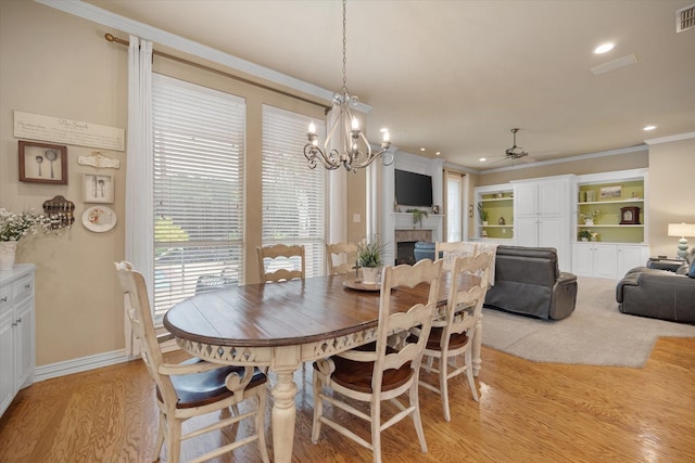 5505 Moorewood Dr, Arlington, TX 76017 - dining room featuring ornamental molding, light wood-style floors, a chandelier, ceiling fan, and recessed lighting