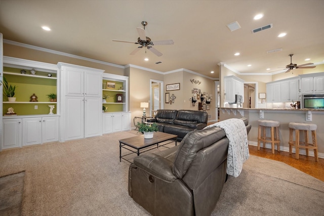5505 Moorewood Dr, Arlington, TX 76017 - living room featuring ceiling fan, recessed lighting, ornamental molding, and light colored carpet