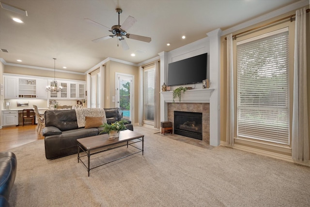 5505 Moorewood Dr, Arlington, TX 76017 - living area featuring crown molding, a tile fireplace, ceiling fan, a chandelier, and recessed lighting