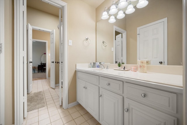 5505 Moorewood Dr, Arlington, TX 76017 - bathroom featuring vanity, tile patterned flooring, a chandelier, and baseboards