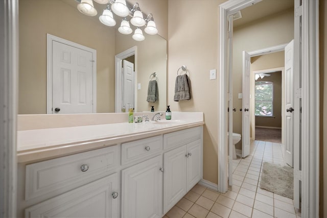 5505 Moorewood Dr, Arlington, TX 76017 - bathroom featuring tile patterned flooring, vanity, toilet, a chandelier, and baseboards
