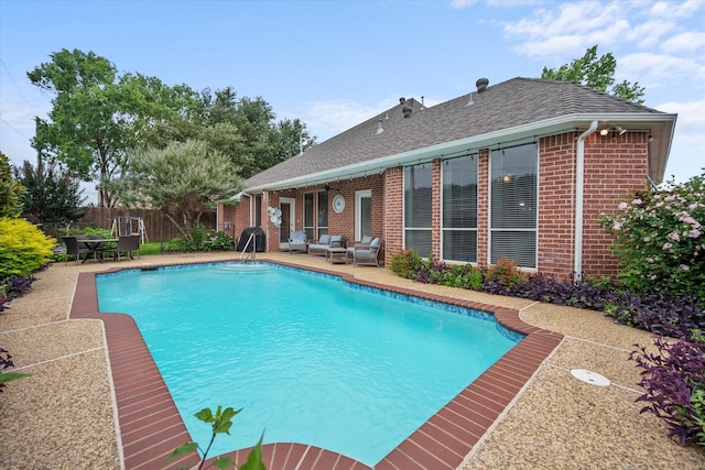 5505 Moorewood Dr, Arlington, TX 76017 - view of swimming pool with a patio and an outdoor living space